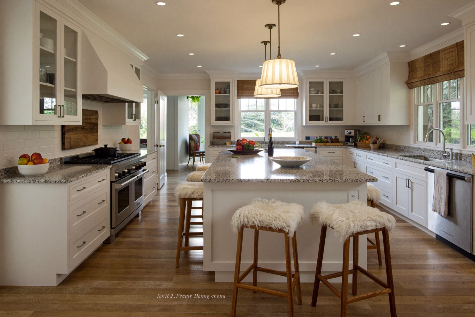 Finished kitchen remodel with island, white shaker cabinets and granite countertops — a mid-range kitchen remodel cost example